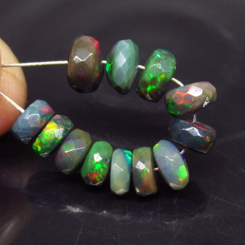 6.61 Ct Natural 12 Drilled Faceted Fire Black Opal: No Reserve! Title: 6.61 Ct Natural 12 Drilled Faceted Fire Black Opal Beads Stone Clarity: Translucent Gemstone: Natural Faceted Black Opal Beads Carat Weights: 6.61 Size/Dimensions: 4.30 to 6.40 mm /