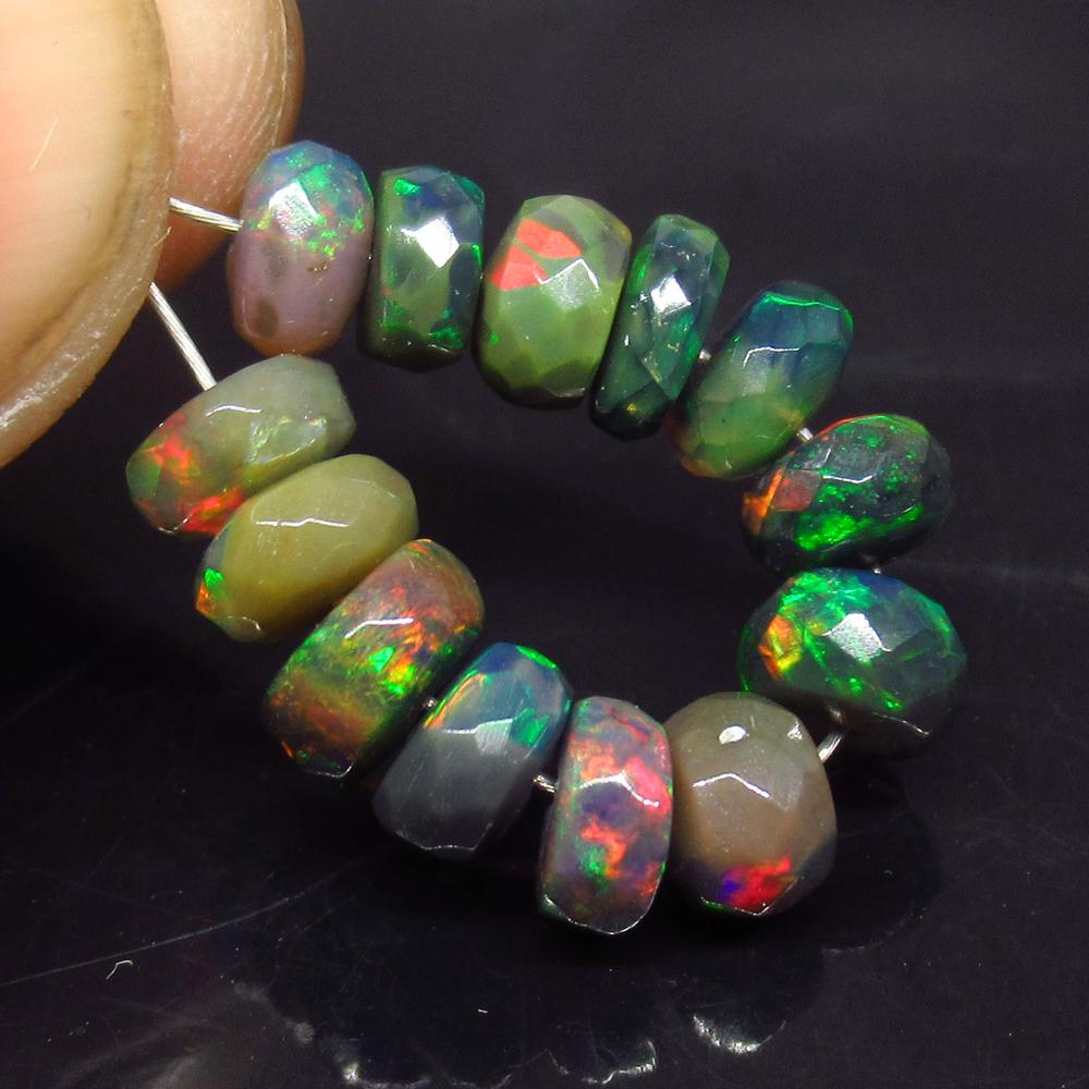 5.79 Ct Natural 13 Drilled Faceted Fire Black Opal: No Reserve! Title: 5.79 Ct Natural 13 Drilled Faceted Fire Black Opal Beads Stone Clarity: Translucent Gemstone: Natural Faceted Black Opal Beads Carat Weights: 5.79 Size/Dimensions: 4.80 to 5.40 mm /
