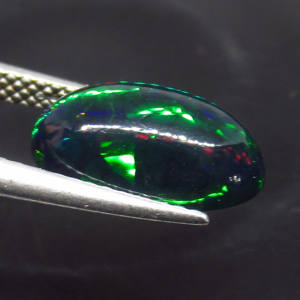 1.98 Ct Natural Ethiopian Fire Black Opal Oval Cab: No Reserve! Title: 1.98 Ct Natural Ethiopian Fire Black Opal Oval Cab Stone Clarity: Translucent Gemstone: Natural Black Opal Carat Weights: 1.98 Size/Dimensions: 12.80 x 7.10 x 4.50 mm Excellent Oval