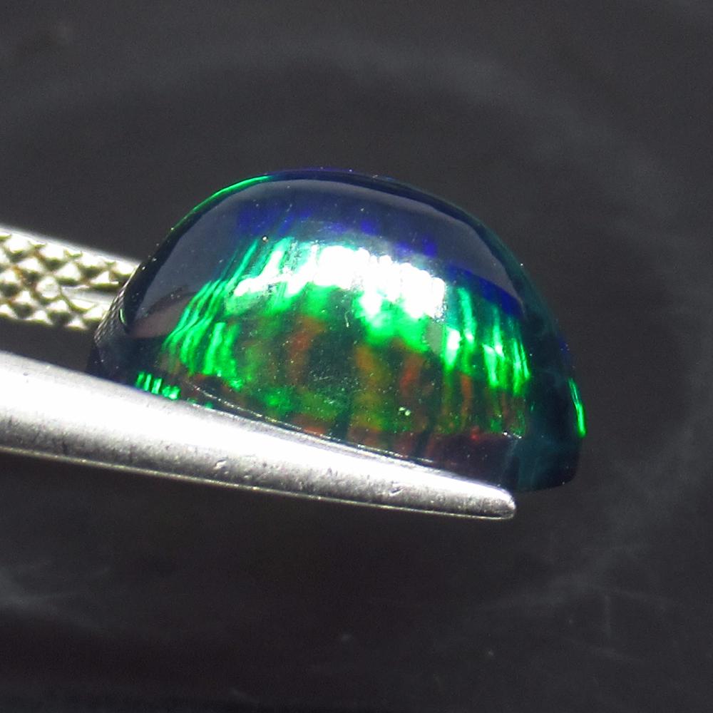 2.39 Ct Natural Ethiopian Fire Black Opal Oval Cab: No Reserve! Title: 2.39 Ct Natural Ethiopian Fire Black Opal Oval Cab Stone Clarity: Translucent Gemstone: Natural Black Opal Carat Weights: 2.39 Size/Dimensions: 11.10 x 7.10 x 6.10 mm Excellent Oval