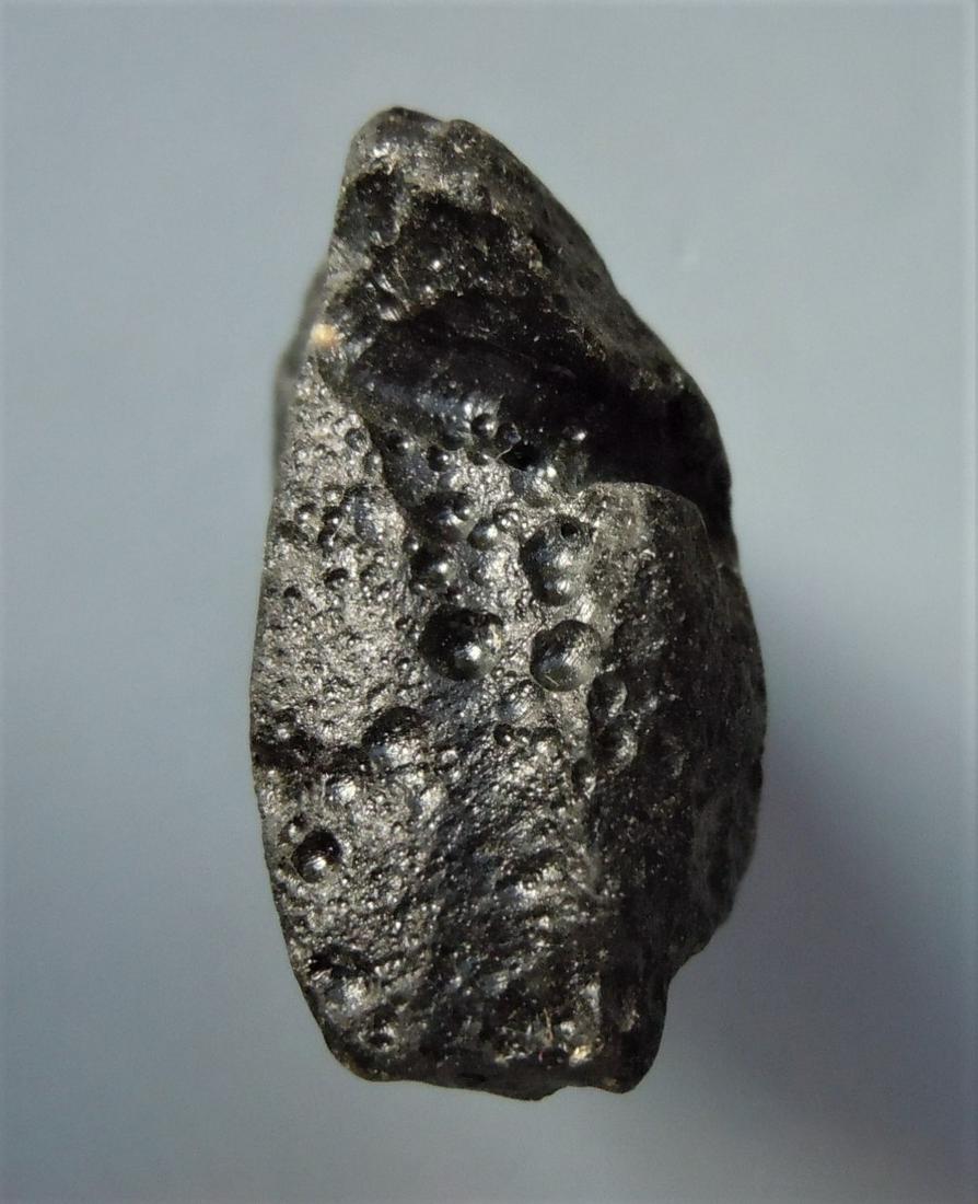 PHILIPPINITE TEKTITE - FROM METEORITE IMPACT: Title: PHILIPPINITE TEKTITE - FROM METEORITE IMPACT Origin: Paracale, Camarines Norte, Luzon, Philippines Size: 2.5x2.5x2 cm / 15 gram Description:rectangular rizalite/philippinite tektite with deep g