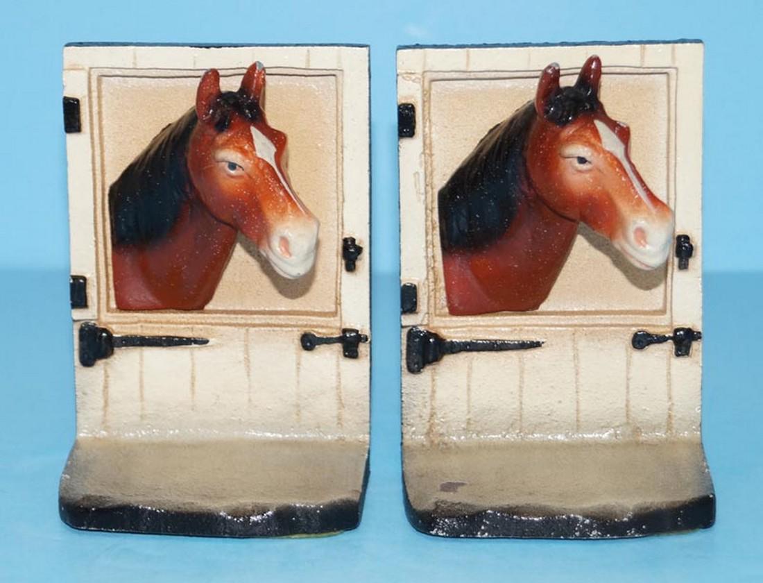 Horse at Barn Stall Door Cast Iron Bookends: Title: Horse at Barn Stall Door Cast Iron Bookends Date/Period: Circa 1930's-40’s. Dimension: 4 3/4" tall x 3 1/4" wide x 3 1/2" deep. Provenance:A pair of Cast Iron Antique Three Dimensional Horse 