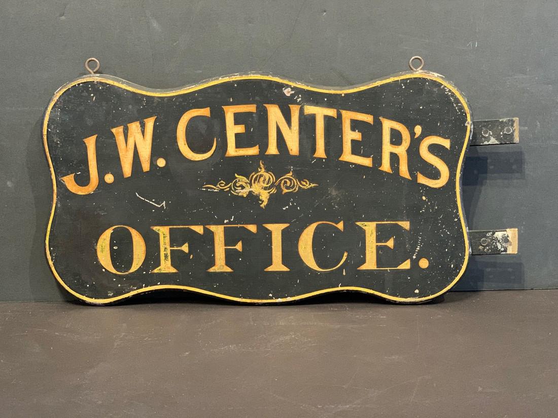 J.W. CENTER’S OFFICE c. 1890 sign: Title: J.W. CENTER’S OFFICE c. 1890 sign Date/Period: c. 1890 Dimension: 9 1/2” h x 19” w Provenance:Original gilding & hardware. Serpentine edge. Bold graphics. Shipping: Domestic: Flat-rate of