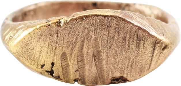MEDIEVAL WOMAN’S FASHION RING C.1200-1400 AD JEWELRY: Size 4 ¼ for the small finger as was the fashion. Ridged band 2.0mm width flaring to the shoulders. A pointed oval bezel cut with three marks on a scored ground in imitation of a signet. This ring wo