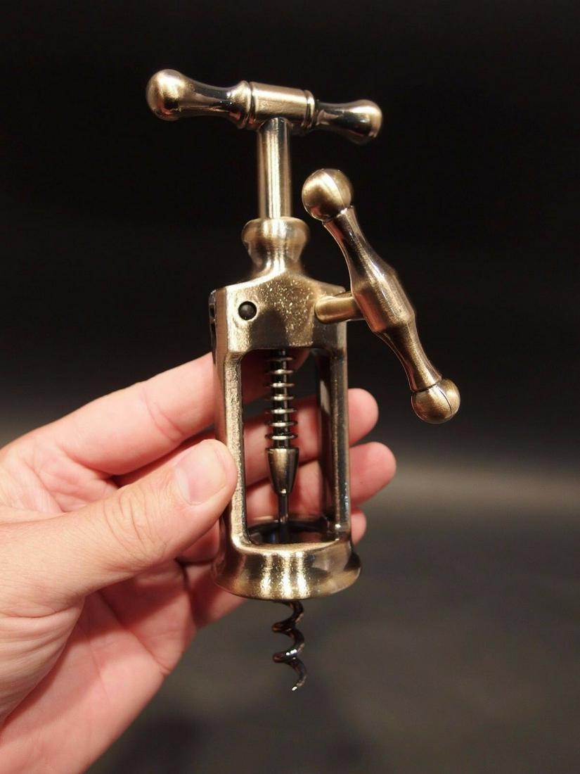 Rack & Pinion Kings Corkscrew Wine Bottle Opener: Antique Vintage Style Rack & Pinion Kings Corkscrew Wine Bottle Opener Description 6 1/2" Long max x 2 3/8" Wide Antique reproduction open frame mechanical rack and pinion corkscrew. The frame is like