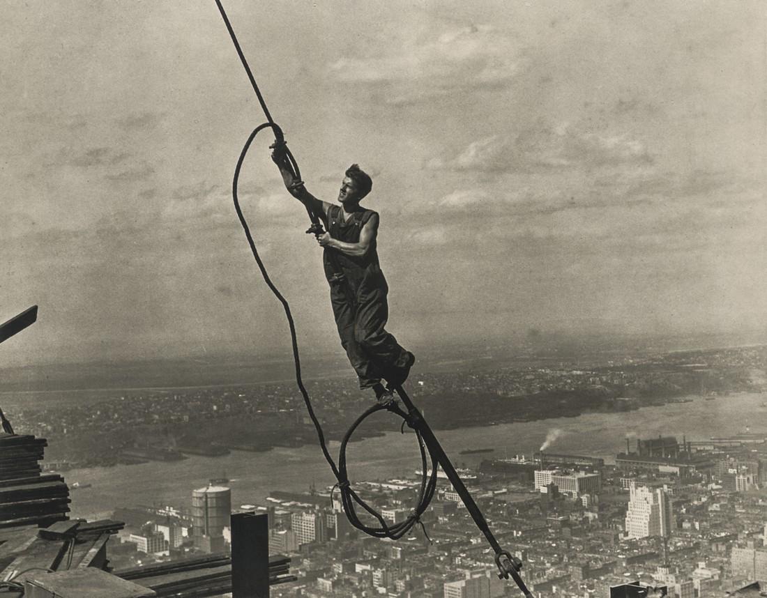 LEWIS HINE - Icarus, Empire State Building, 1930: Artist: Lewis Hine Title: Icarus, Empire State Building, 1930 Medium: Photo Litho, 1989, USA Dimensions: 7.95x6.2" Heat Wax Mounted on 8.5x11" Conservation Board Lewis Wickes Hine (1874 - 1940) was an