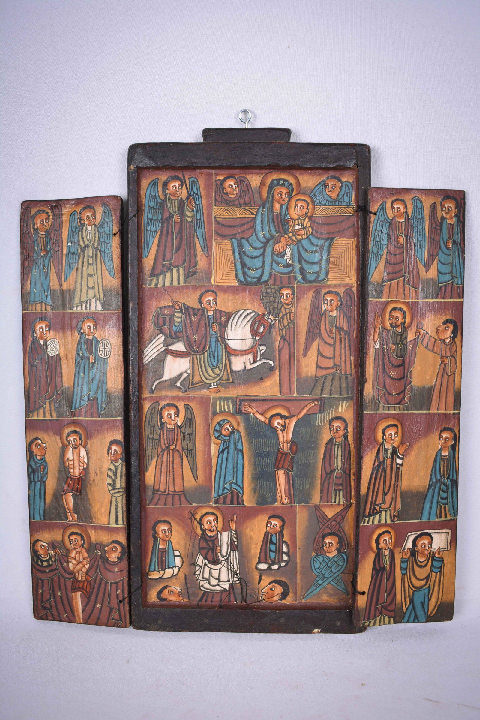Coptic Triptych – Wood – Ethiopia: Title: Coptic Triptych – Wood – Ethiopia Description: Antique wooden triptych, hand painted from Ethiopia. Good condition with beautiful carvings in the wood. Provenance: former private collection