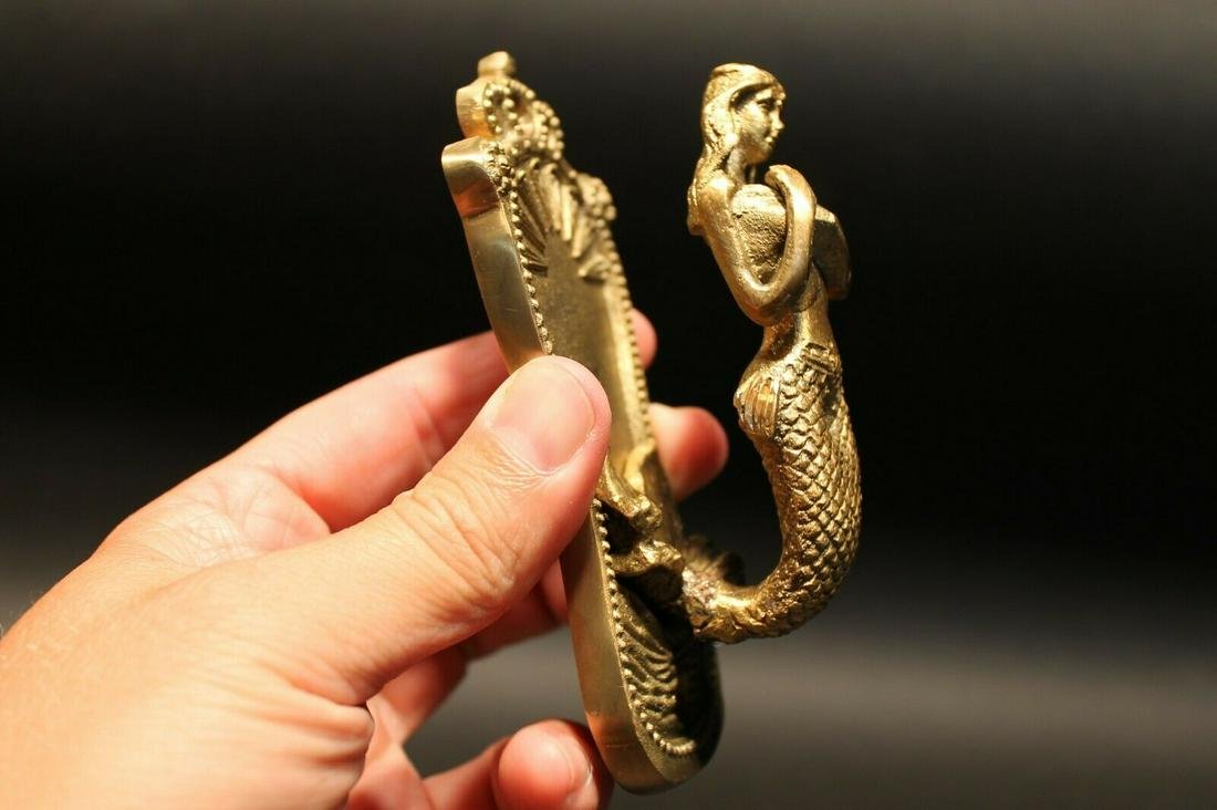 Brass Mermaid Wall Hook: (1) Hook 4 3/4" Tall.. 2 1/8" Wide 2" Extension1 Charming and functional sturdy brass mermaid wall hook cast from an antique. Wonderful detail! Reserve: $20.00 Shipping: Domestic: Flat-rate of $6.00 t