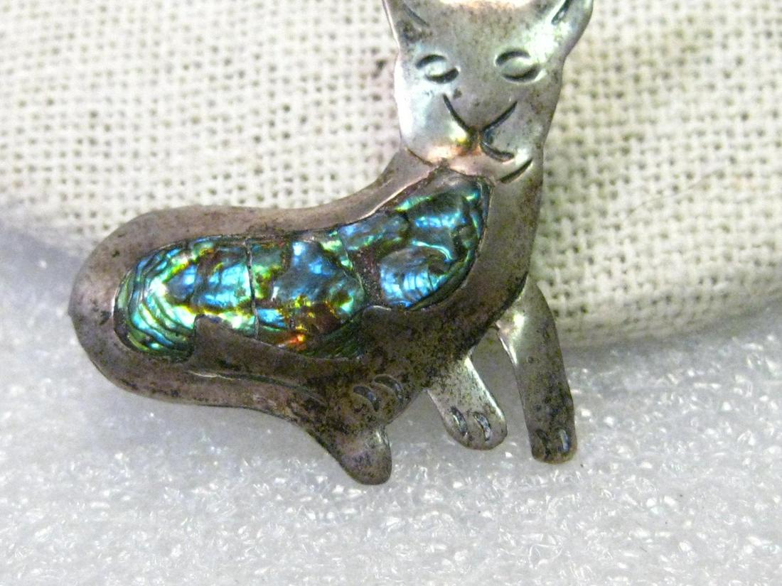Vintage Sterling Silver Taxco Inlaid Abalone Cat: Vintage sterling silver inlaid abalone cat brooch, signed "Taxco, AA 925, Broche." It has been tested and tests as sterling too. It is 1.25" wide and 1" tall. It does have vintage patina/tarnish that