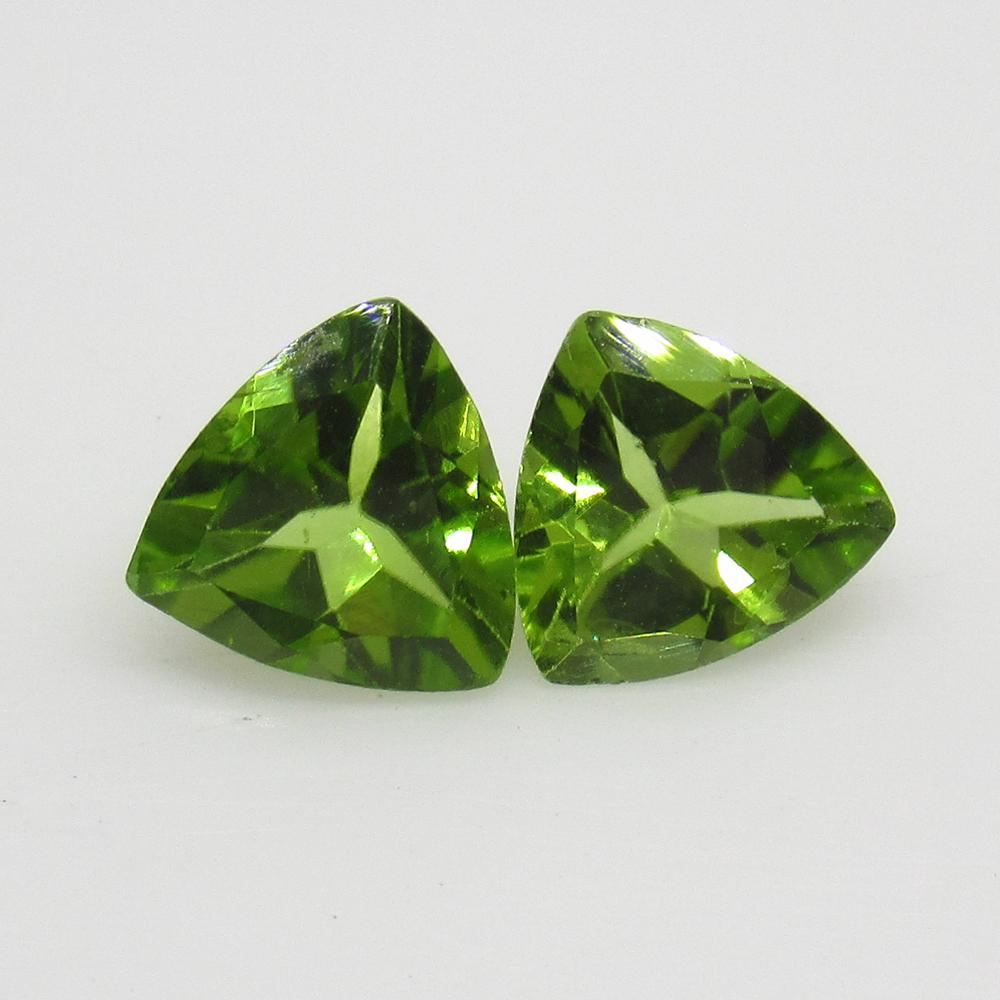 2.22 Ct Natural Pakistan Peridot Trillion Pair: No Reserve! Title: 2.22 Ct Natural Pakistan Peridot Trillion Pair Stone Clarity: VVS Gemstone: Natural Peridot Carat Weights: 2.22 Size/Dimensions: 7.10 x 7.10 x 4.00 mm / 2 PC's Top Class Full Luster