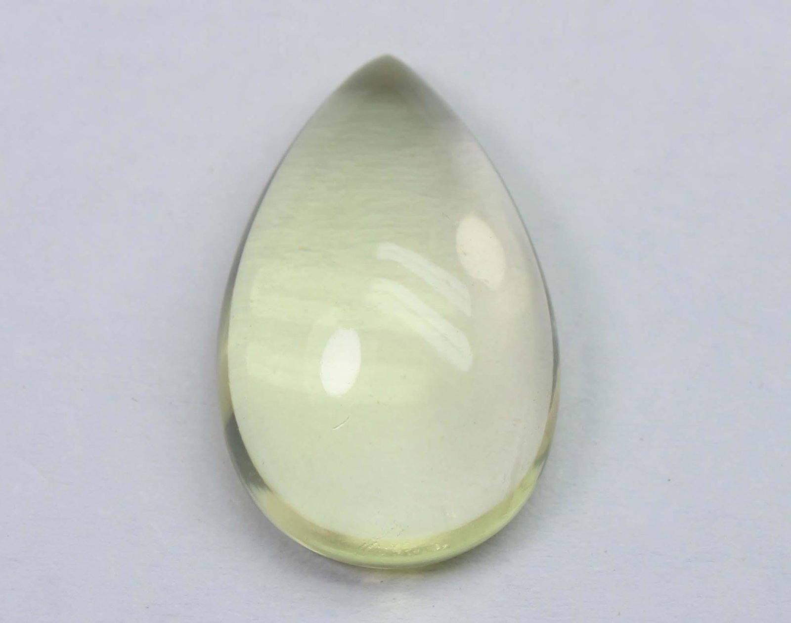 11.94 Cts Natural Lemon Quartz: No Reserve! Title: 11.94 Cts Natural Lemon Quartz Additional Information: Gemstone : Natural Lemon QuartzWeight : 11.94 CtsShape : Pear CabuchonColour : Greenish Yellow Dimensions : 20.6x13.1x6.9 mmOr