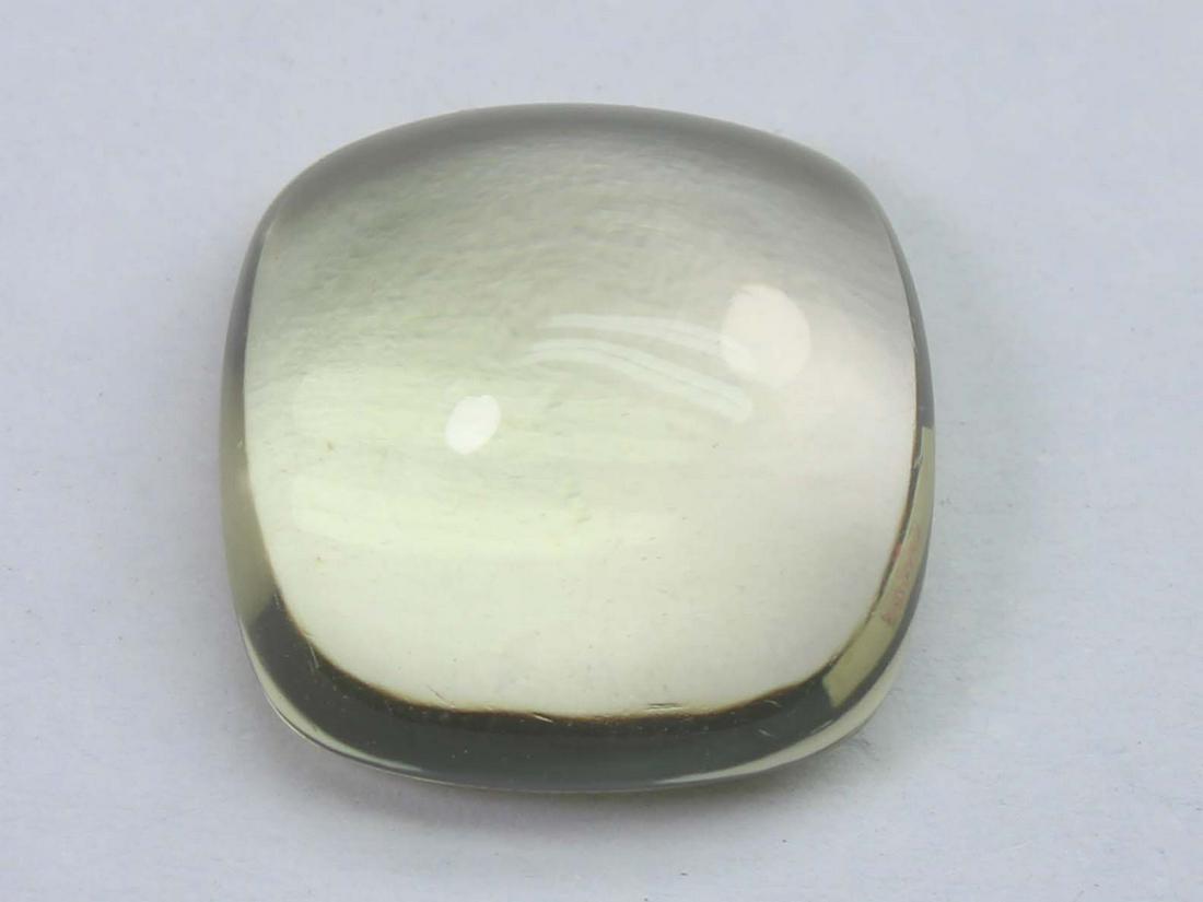 10.70 Cts Natural Lemon Quartz: No Reserve! Title: 10.70 Cts Natural Lemon Quartz Additional Information: Gemstone : Natural Lemon QuartzWeight : 10.70 CtsShape : Square Cushion CabuchonColour : Greenish Yellow Dimensions : 14x13.9x