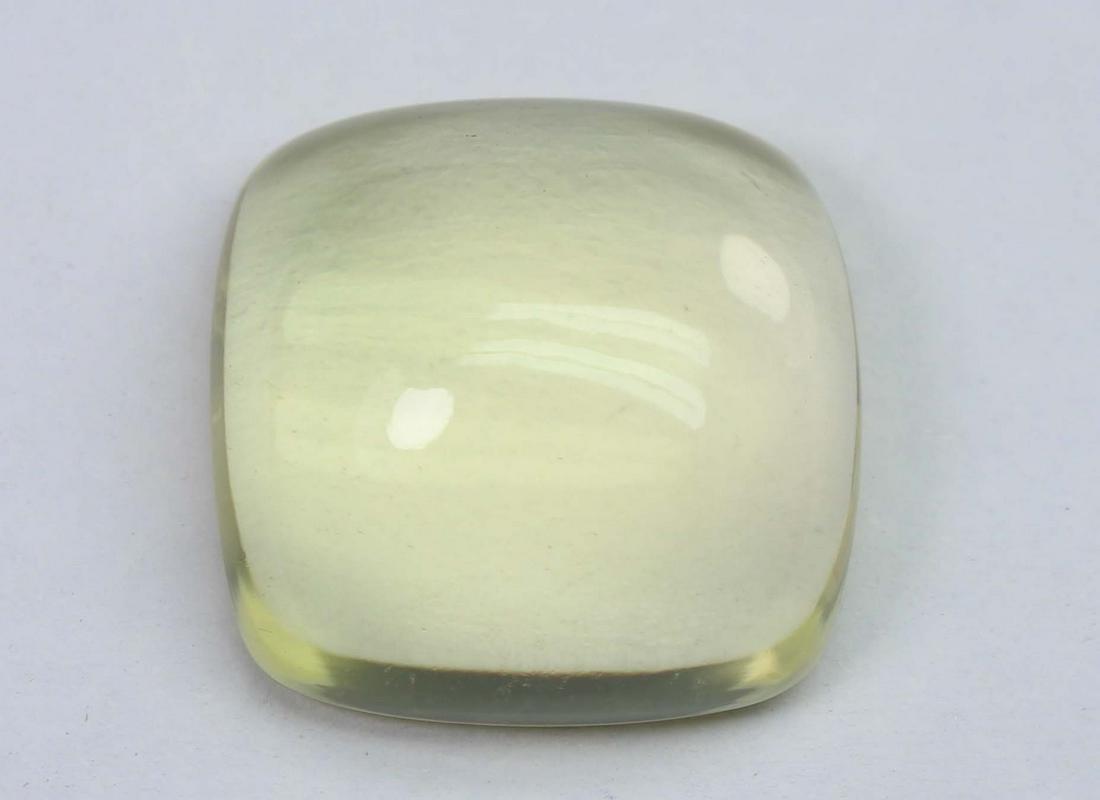 19.44 Cts Natural Lemon Quartz: No Reserve! Title: 19.44 Cts Natural Lemon Quartz Additional Information: Gemstone : Natural Lemon QuartzWeight : 19.44 CtsShape : Square Cushion CabuchonColour : Greenish Yellow Dimensions : 17.1x17x