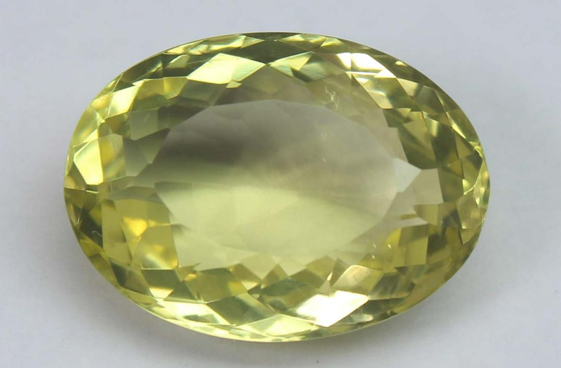 9.08 Ct Natural Lemon Quartz: No Reserve! Title: 9.08 Ct Natural Lemon Quartz Additional Information: Gemstone : Natural Lemon QuartzWeight : 9.08 CtsShape : Oval CutColour : Greenish Yellow Dimensions : 16.3x11.9x7.5 mmOrigin : A
