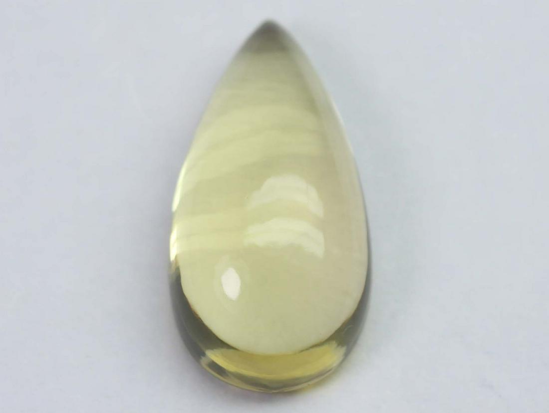 7.95 Cts Natural Lemon Quartz: No Reserve! Title: 7.95 Cts Natural Lemon Quartz Additional Information: Gemstone : Natural Lemon QuartzWeight : 7.95 CtsShape : Pear CabuchonColour : Greenish Yellow Dimensions : 19.2x9.5x6.2 mmOrigi