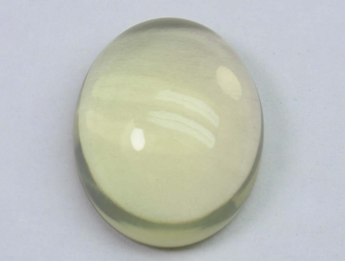 18.72 Cts Natural Lemon Quartz: No Reserve! Title: 18.72 Cts Natural Lemon Quartz Additional Information: Gemstone : Natural Lemon QuartzWeight : 18.72 CtsShape : Oval CabuchonColour : Greenish Yellow Dimensions : 20.1x15.7x8.1 mmOr