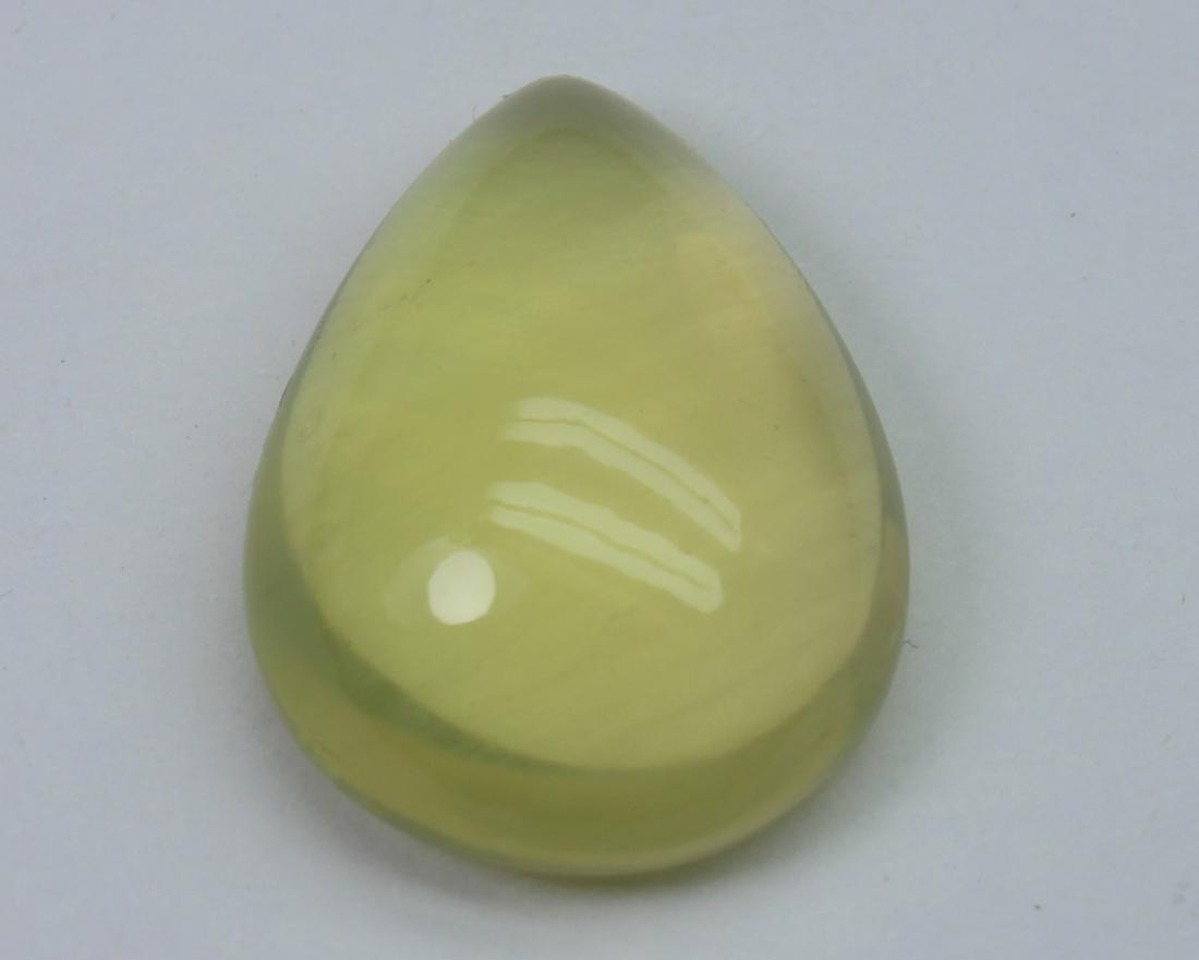 10.92 Ct Natural Lemon Quartz Cabochon: No Reserve! Title: 10.92 Ct Natural Lemon Quartz Cabochon Additional Information: Gemstone: Natural Lemon QuartzOrigin: Africa Weight: 10.92 Carats Measurements: 18.3x13.7x6.8 mm Shape / Cut: Pear Cab