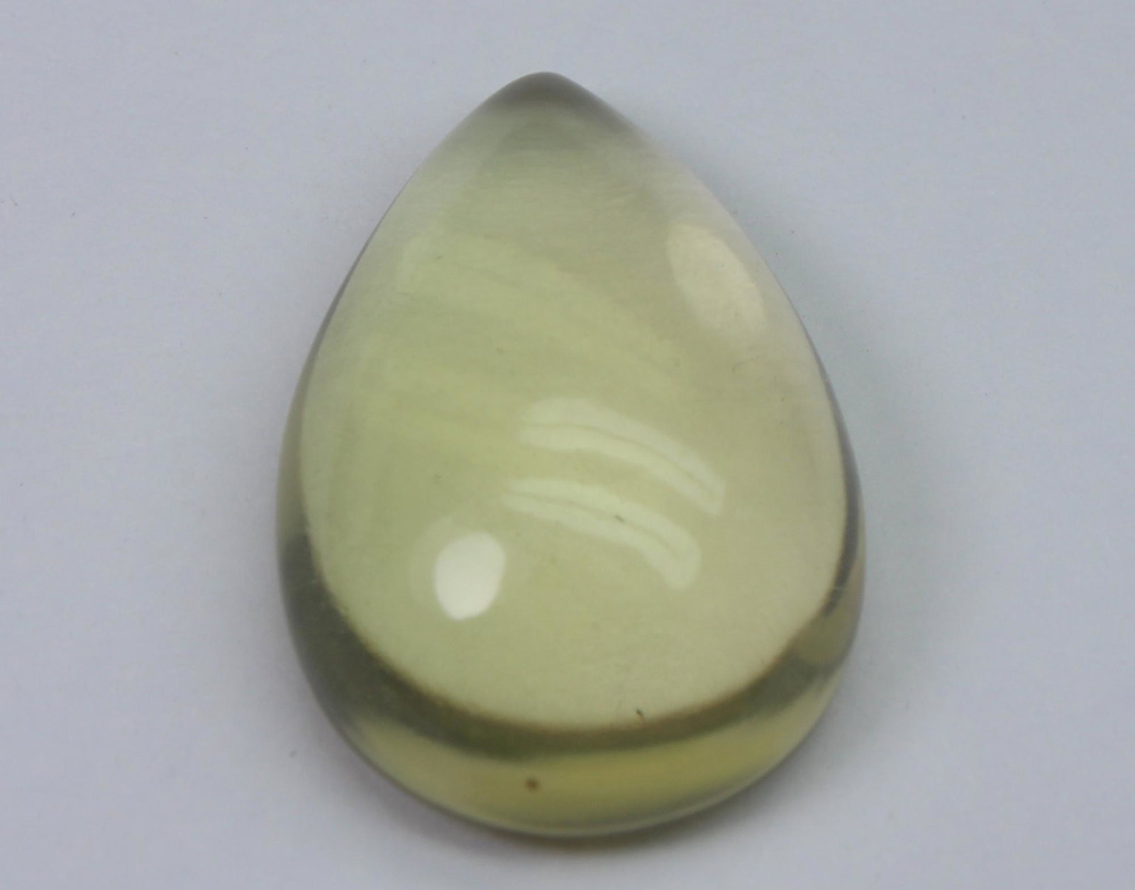 18.00 Ct Natural Lemon Quartz Cabochon: No Reserve! Title: 18.00 Ct Natural Lemon Quartz Cabochon Additional Information: Gemstone: Natural Lemon QuartzOrigin: Africa Weight: 18.00 Carats Measurements: 20.2x15.4x8 mm Shape / Cut: Pear Caboc
