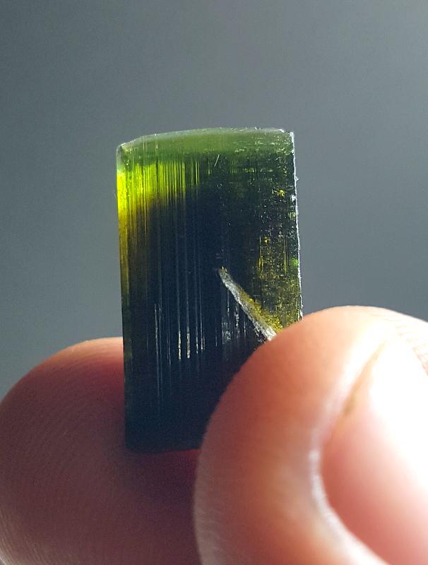 04 Grams Beautiful Green Cap Tourmaline Crystal: No Reserve! Title: 04 Grams Beautiful Green Cap Tourmaline Crystal Specimen From Astak Skardu pakistan Color/Clarity: Green Gemstone Type: Crystal Size/Dimensions: 20*11*10 mm Shipping: Domestic: Flat