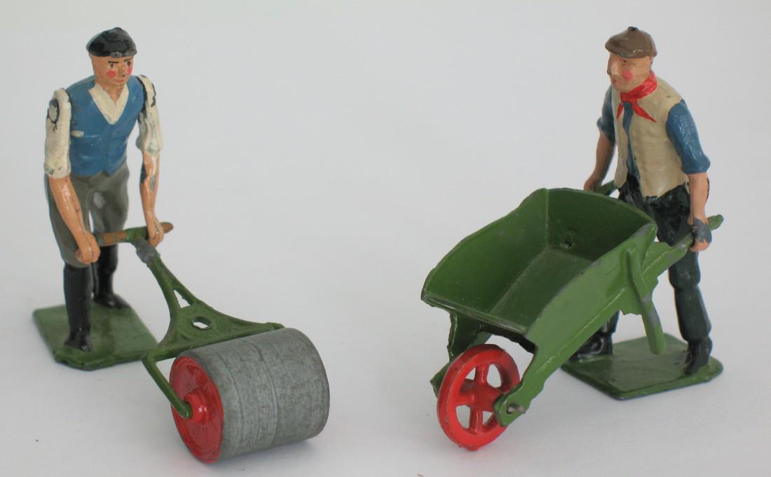 Interesting pair of Britain metal figures.: Title: Interesting pair of Britain metal figures. Date/Period: 1930's Dimension: 2 1/2” tall Description:Nice vintage pair of metal Britain figures, a man with a lawn roller & a man with a wheelbarr