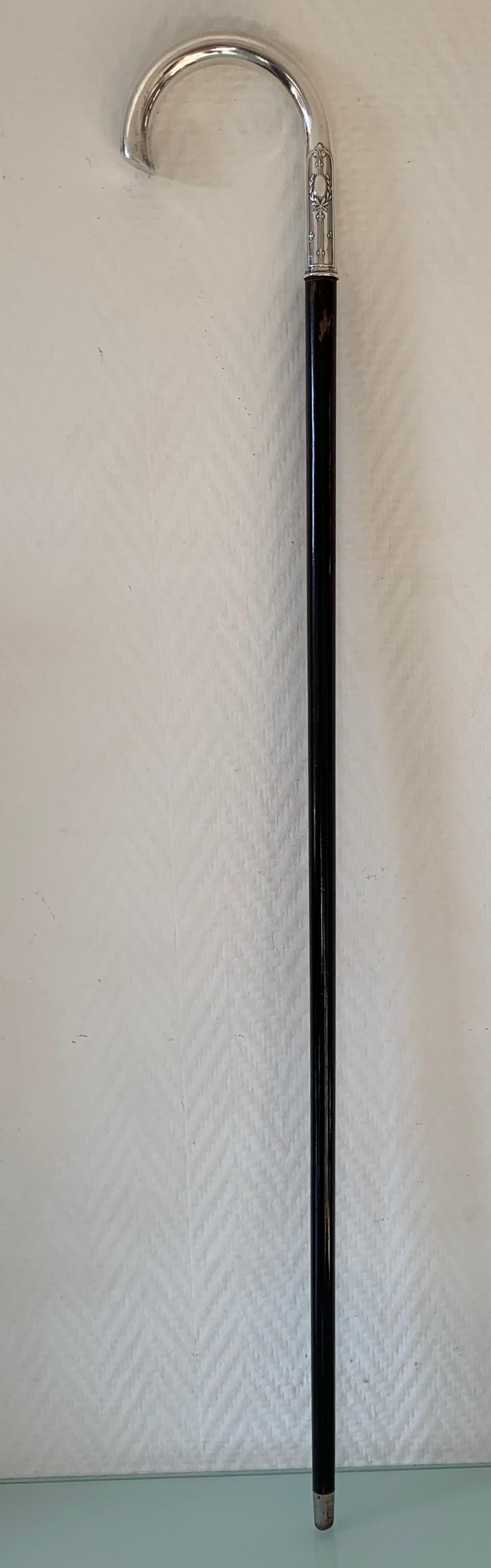 Art Deco French Silver cane with ebonised palissander: Title: Art Deco French Silver cane with ebonised palissander wood Date/Period: Early 20th century Materials: Silver 800, ebonised palissander wood and steel Dimensions: HxWxD: 36.2 x 0.8 x 4.7 inch /9