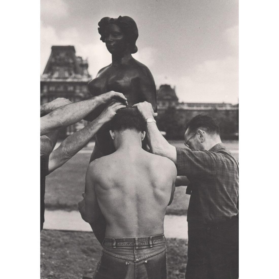 ROBERT DOISNEAU - La Liberte dorlotee: Artist: ROBERT DOISNEAU Print Title: La Liberte dorlotee par les emploes de la Maison Gougeon Medium: Photo-engraving Printing Date: 1970's Printed in Switzerland Image Size approx: 11.5 x 8.25 inches