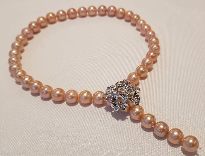 11x13mm Pink Edison Pearls - Necklace: Most freshwater pearls are nucleated by tissue, but Edison cultured pearls are nucleated with beads, exactly as saltwater pearls This luxurious necklace contains 43 Edison Pearls which were chosen for