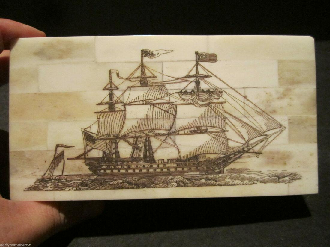 Folk Art Sail Ship Scrimshaw Etched Bone & Wood Trinket: 6 3/8" Long x 3 7/8" Wide x 1 5/8" High Wonderful new reproduction scrimshaw carved ox bone box. As you can see this piece is tiled with bone on wood and decorated with a design typical of the period.