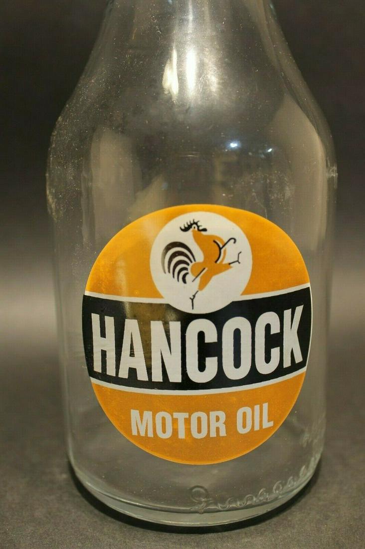Vintage Style "Hancock" 1 Quart Glass Motor Oil Bottle: Description 14" tall x 3 3/4" Wide Well made reproduction 1 quart Hancock Motor oil bottle. As you can see this glass oil bottle comes with the spout and cap as shown. The Mohawk motor oil logo is in