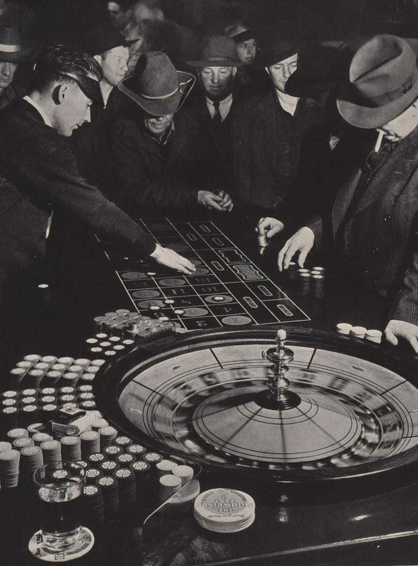 MARGARET BOURKE WHITE - At the Roulette Wheel, Elko, NV: Artist: MARGARET BOURKE WHITE Print Title: At the Roulette Wheel, Elko, NV Printing Date: 1940Â’s Medium: Photoengraving Printed in: the US Image Size: 10.5 x 8Â” Reserve: $20.00 Shipping: Domes