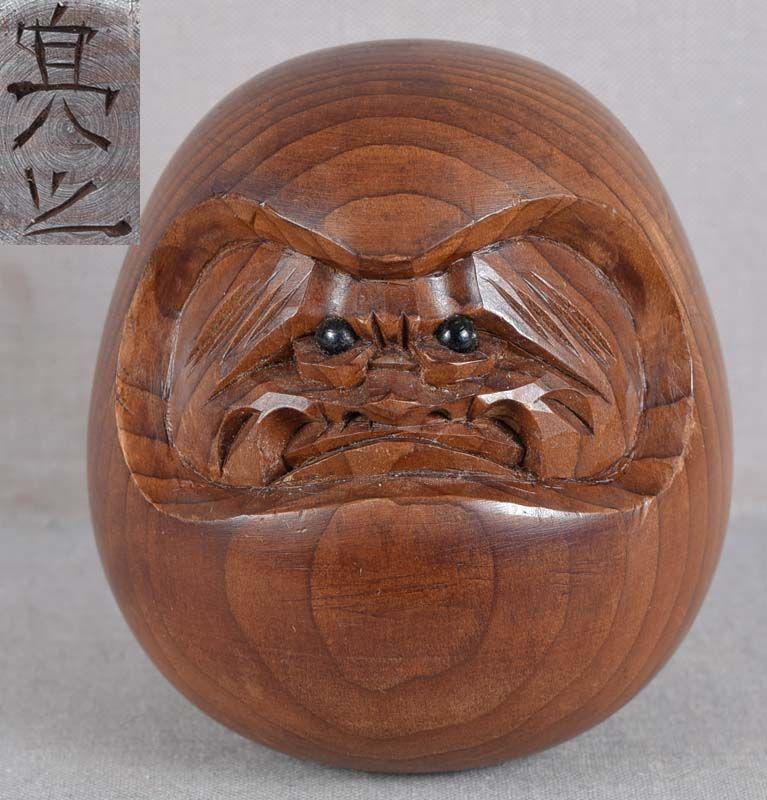 19c okimono DARUMA by netsuke carver SUKEYUKI: Late Meiji period (1890s -1912) wooden okimono of cloth doll of Daruma (founder of Zen Buddhism) enveloped in his monastic robe. The subject represents Daruma coming back from deep trance in which he 