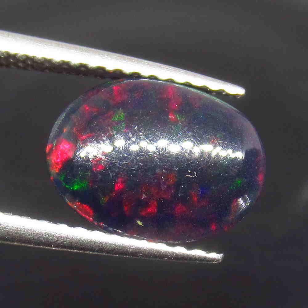 1.50 Ctw Natural Ethiopian Black Fire Opal Oval Cab: No Reserve! Title: 1.50 Ctw Natural Ethiopian Black Fire Opal Oval Cab Stone Clarity: Opaque Gemstones: Black Opal Carat Weights: 1.5 Size/Dimensions: 10.50 x 8.00 x 4.70 mm Additional Information: Ex