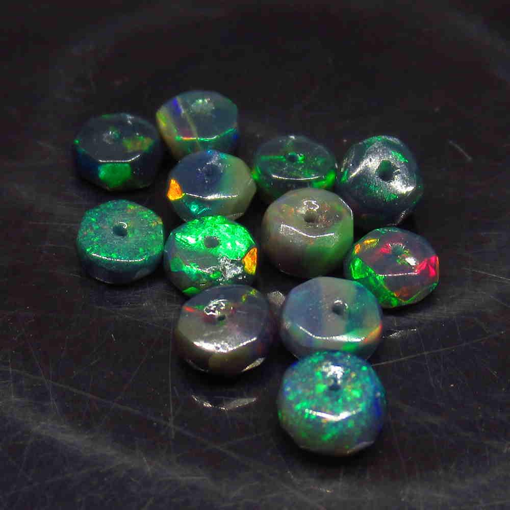 2.69 Ctw Natural 12 Drilled Faceted Black Opal Beads: No Reserve! Title: 2.69 Ctw Natural 12 Drilled Faceted Black Opal Beads Stone Clarity: Translucent Gemstones: Faceted Black Opal Beads Carat Weights: 2.69 Size/Dimensions: 4.20 to 4.40 mm / 12 PC's Ad