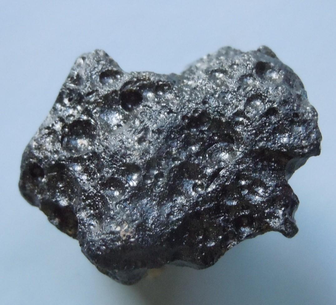 PHILIPPINITE TEKTITE - FROM METEORITE IMPACT: Title: PHILIPPINITE TEKTITE - FROM METEORITE IMPACT Origin: Paracale, Camarines Norte, Luzon, Philippines Size: 2x1.5x1 cm / 4 gram Additional Information: small ornamental rizalite/philippinite tekti