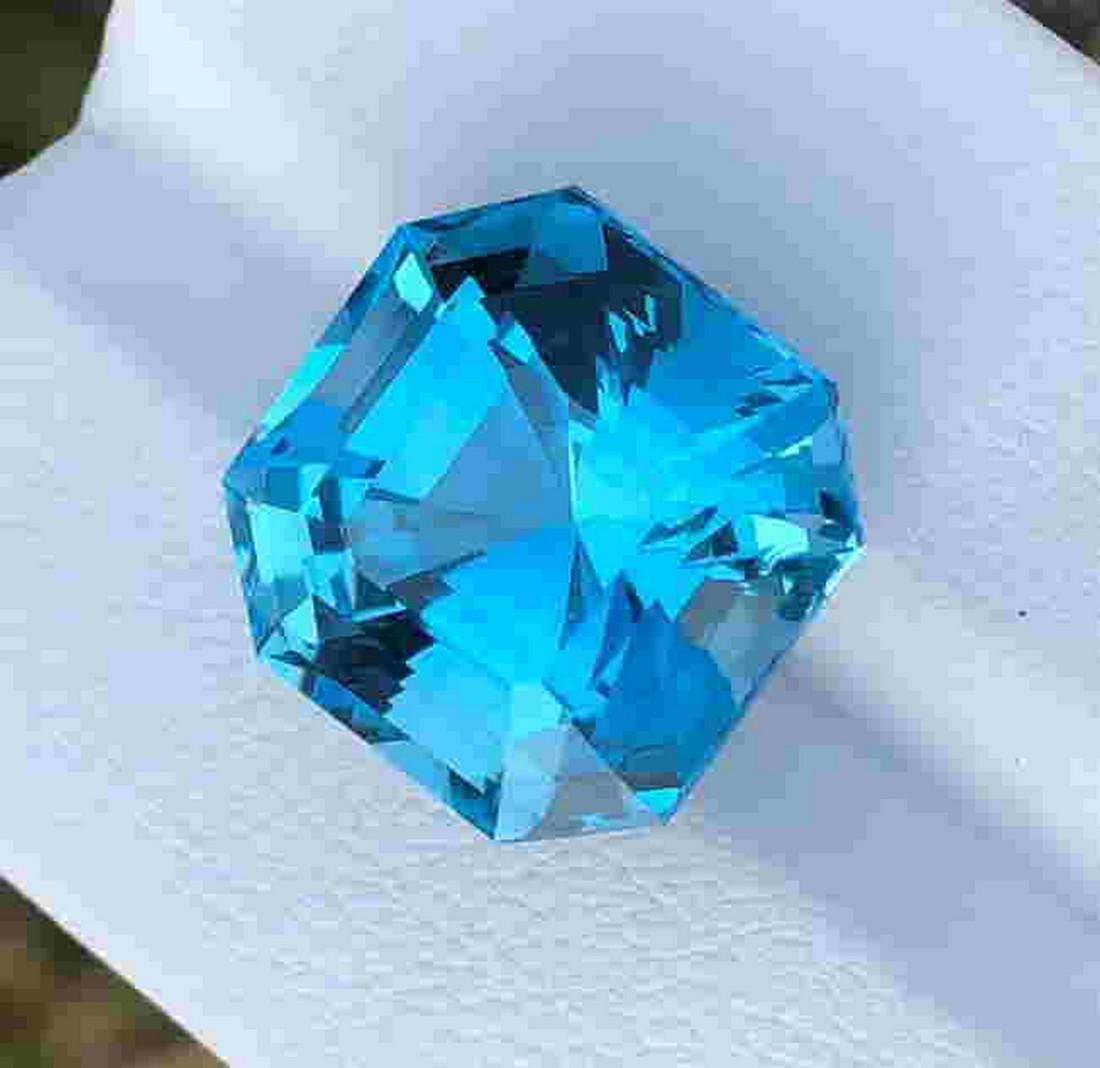 20 Carats Assher Cut Blu Topaz ~ 15x15x12 MM: Title: 20 Carats Assher Cut Blu Topaz ~ 15x15x12 MM Origin: Swiss Gemstones: Blu Topaz Carat Weights: 20 Carats Size/Dimensions: 15x15x12 MM Additional Information: Natural Reserve: 150 Shipping: