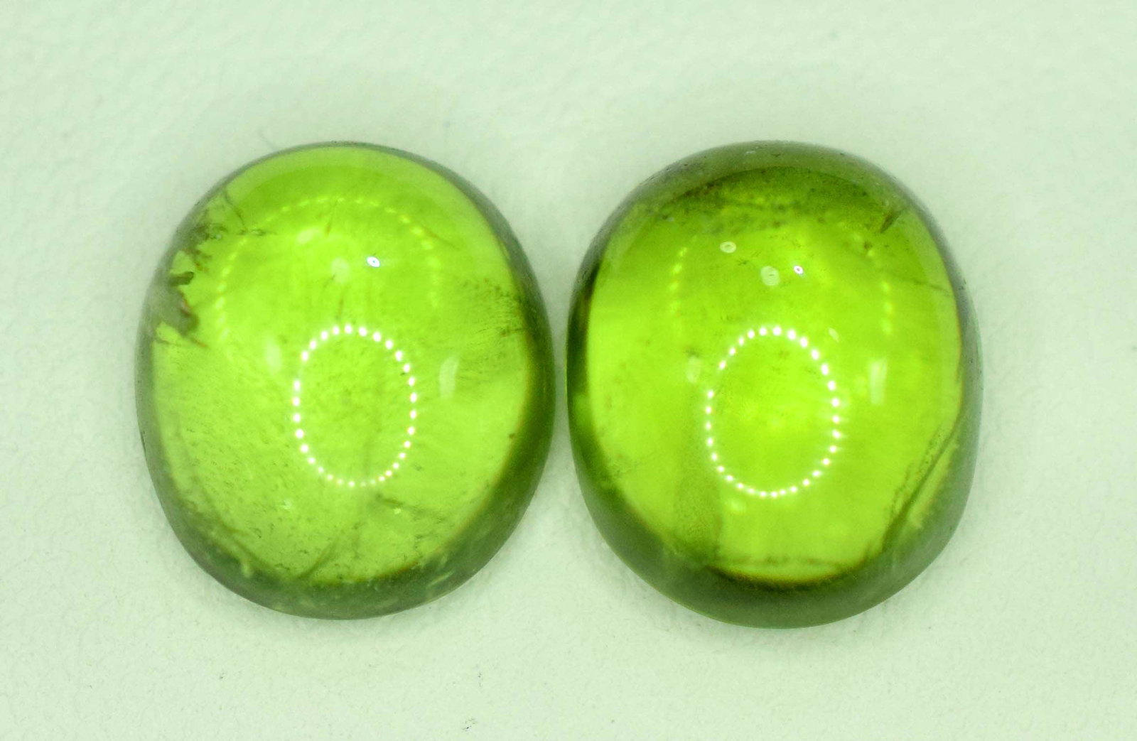 9.60 Carats Polished Peridot Cabochons Pair: Handmade Material peridot more Dimensions Carat weight: 9.60 Description 9.60 carats Attractive Juicy Olivine Color Peridot Polished Cabochons Pair From Suapt Mines Paksiatan