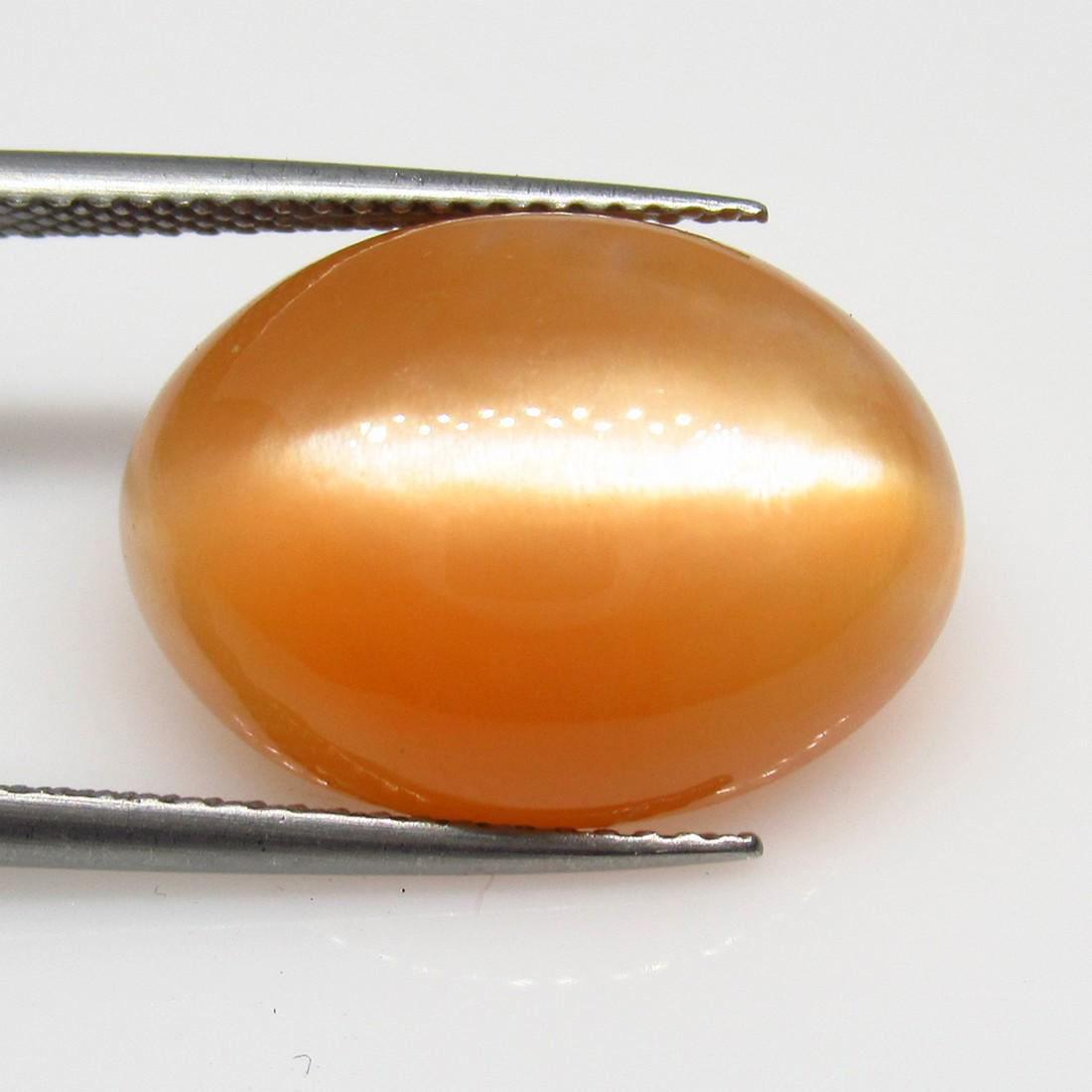 12.50 Ctw Natural Orange Moonstone Catseye Oval Cab: Title: 12.50 Ctw Natural Orange Moonstone Catseye Oval Cab Stone Clarity: Transparent Gemstones: Moonstone Catseye Carat Weights: 12.5 Size/Dimensions: 18.40 x 13.40 x 7.20 mm Additional Information: