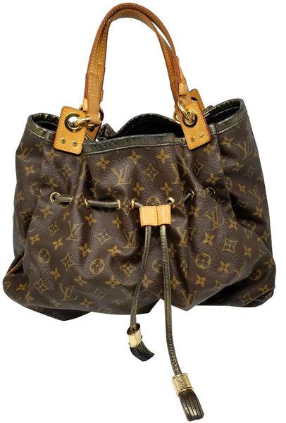 Louis Vuitton Irene Monogram Hobo Tote Limited Edition: Style/Model: Irene Limited Edition Designer: Louis Vuitton Dimensions: 11 x 5 x 12.5" Accessories: None Condition is Great with light wear to the gold black shimmer of the piping trim, scattered spots