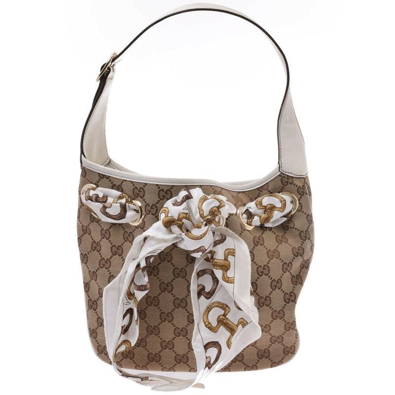 Gucci GG Canvas Shoulder Bag: Brand: Gucci Model: GG Canvas Shoulder Bag Color: Brown Material: Canvas Dimensions: H:23cm x W:27cm x D:2cm Serial number: 155562204990 Country of origin: Italy Condition: AB - good condition. May ha