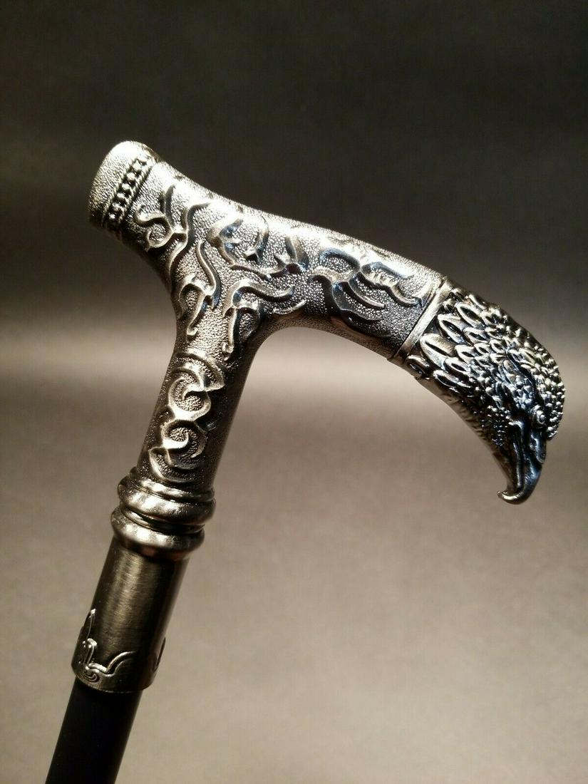 35" Eagle Metal Walking Stick Cane: 35" long Such a neat antique style walking cane. As you can see the all metal cane has a highly detailed eagle head handle with a hollow metal shaft to a rubber foot. Nice heavy quality! Reserve: $30.