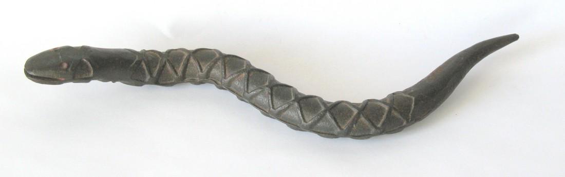 Early wrought iron snake. (1 of 2)