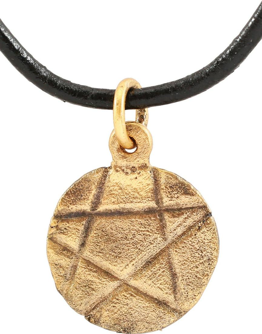 MEDIEVAL MYSTICAL AMULET C.1300-1500: Circular, just under 5/8” diameter inscribed with a pentagram. Professionally refurbished with the silver surface restored on a polished leather neck cord for modern wear. The pentagram is found in 