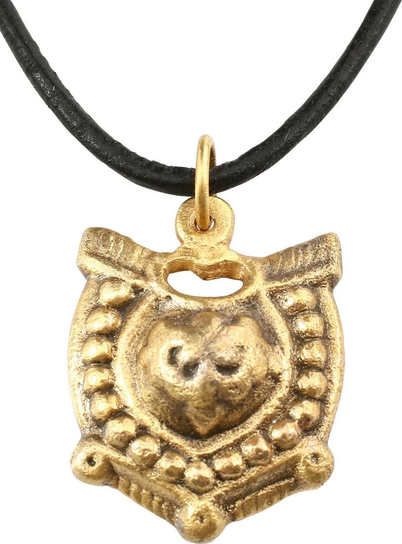 FINE ANCIENT VIKING HEART PENDANT 900-1050 AD.: Just under 1 1/8” height, with nubs at the sixth points. Central heart of particularly high relief embellished with incised scrolls and surrounded by a border of domes or dots. Above, a pierced hear