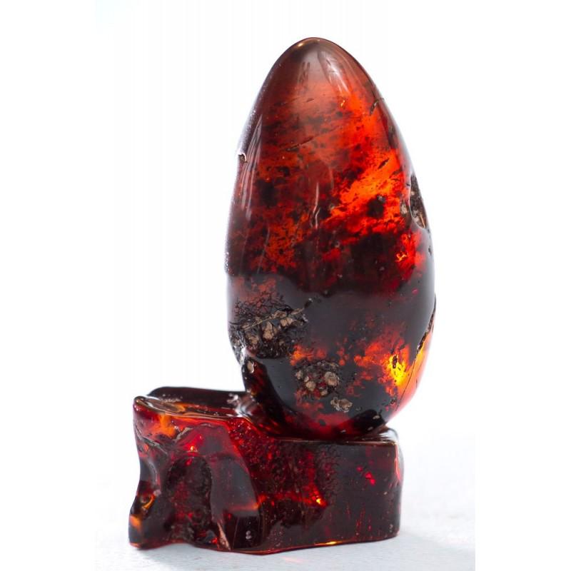 40 g. Natural Amber egg on a stand hand carved from (1 of 9)