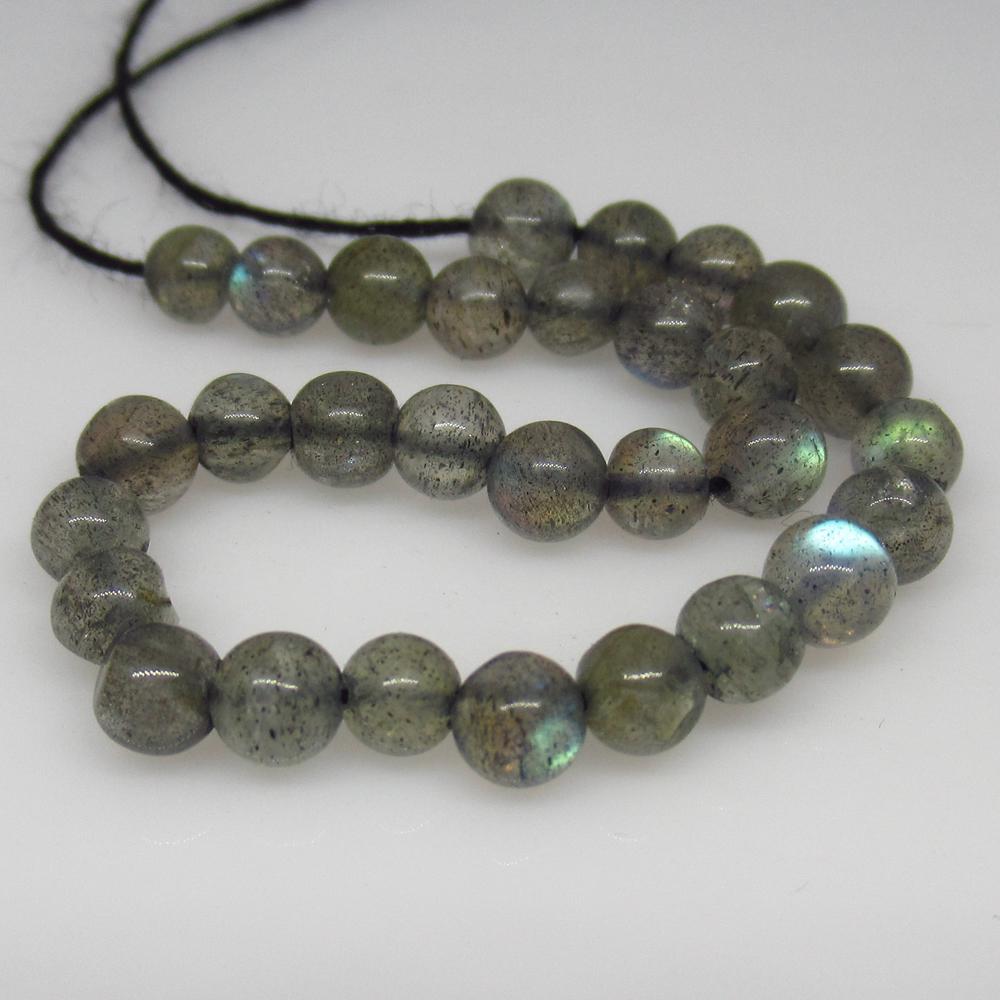 13.54 Ct Natural 30 Labradorite Drilled Round Ball: No Reserve! Title: 13.54 Ct Natural 30 Labradorite Drilled Round Ball Beads Color/Clarity: Transparent Gemstone: Natural Labradorite Beads Carat Weight: 13.54 Size/Dimensions: 3.60 to 4.00 mm / 30 PC'