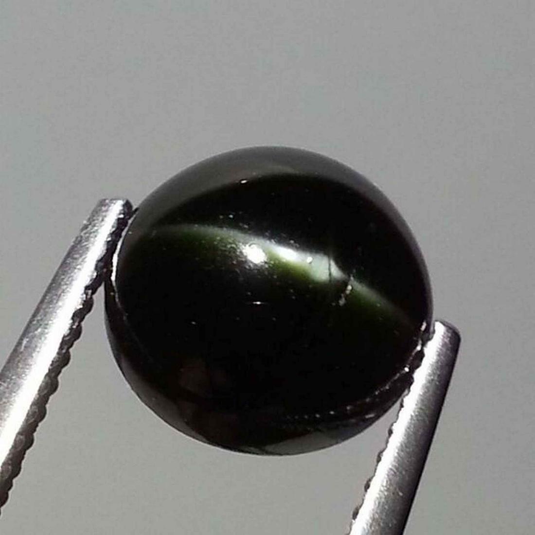 Natural Kornerupine Cat's Eye 3.99 ct: No Reserve! Title: Natural Kornerupine Cat's Eye 3.99 ct Color/Clarity: Opaque Gemstones: Loosegemstone Carat Weights: 3.99 Size/Dimensions: 9.20 x 9.20 x 5.30 Additional Information: Round - Srilanka