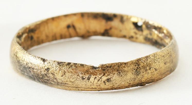 VIKING WEDDING RING SZ5: Late 9th-early 11th century AD. Gilt bronze, size 5. Medium width band 3.1mm, with a rounded face. The inside with distinct tool marks from a removal of the central core after casting. Professionally 