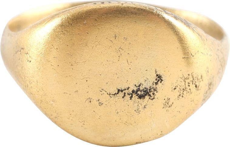 VIKING MAN’S RING C.850-1050 AD: Deeply rounded section band, narrow at the bottom and flaring to the shoulders. Knurled edge circular bezel of slightly domed section, undecorated. Raised oval bezel with addorsed curvilinear incised 