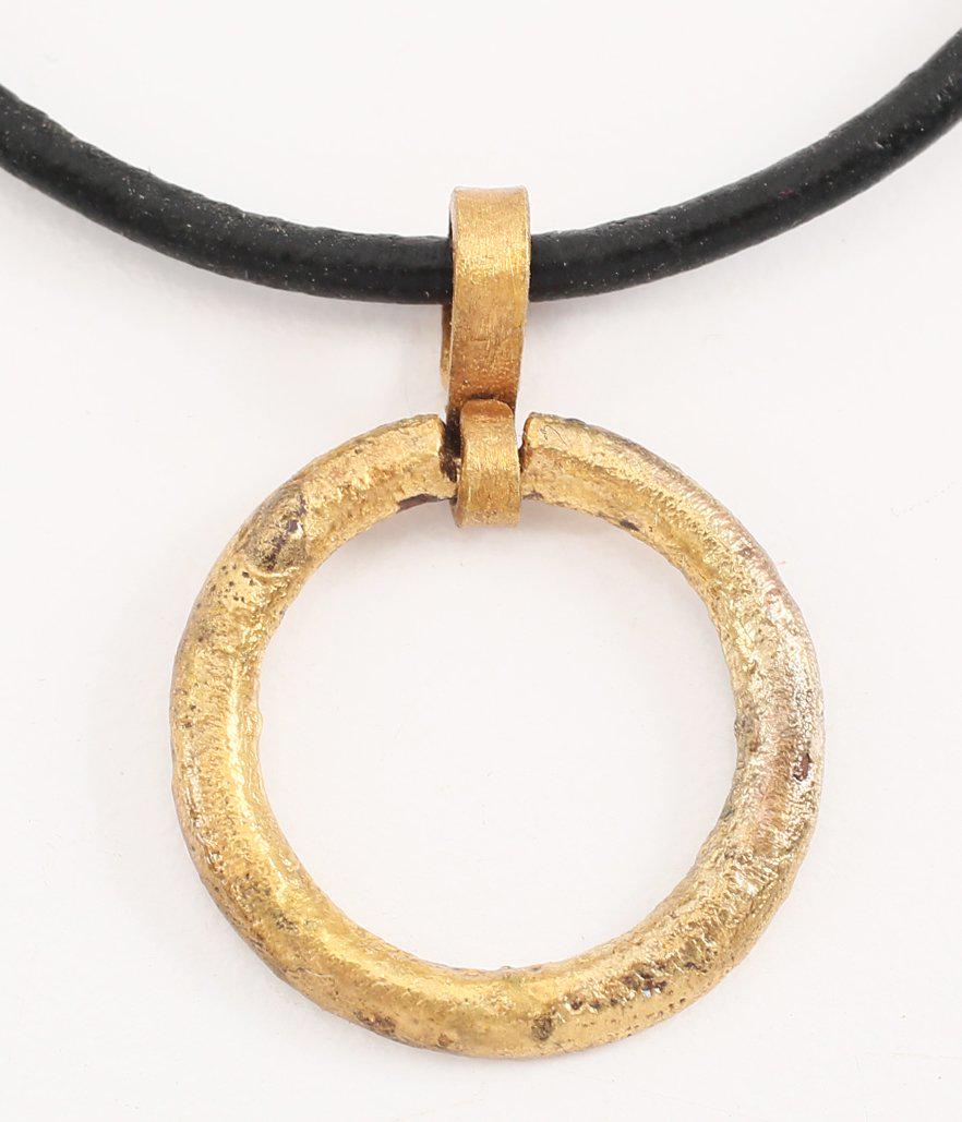 VIKING PROTECTIVE BROOCH Necklace, 10th-11th CENTURY.: Bronze, just over 3/4” diameter. Rounded faces both sides. Textured from burial. Worn in numbers, these were decorative as well as serving as a measure of protection from sword blows. See multiple i