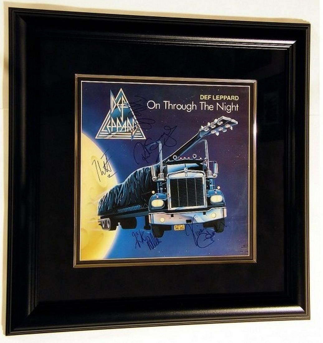 De Leppard "On Through The Night" 1980: Title: De Leppard "On Through The Night" 1980 Materials: Black Frame with UV Glass and Suede Matting Dimension: 21 1/2 x 21 1/2 Inch Provenance:Signed: Joe Elliott, Vivian Campbell, Rick Savage, Rick 